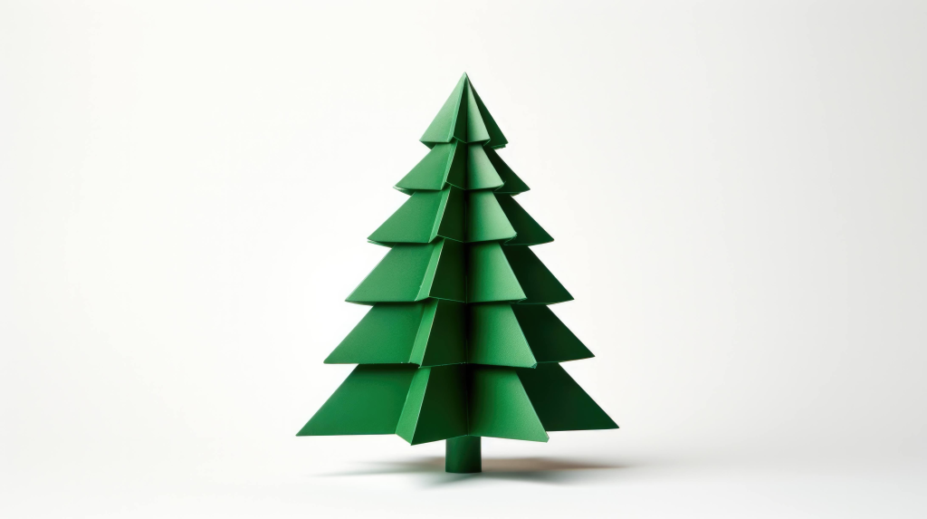 An origami pine tree, stands against a white background. 